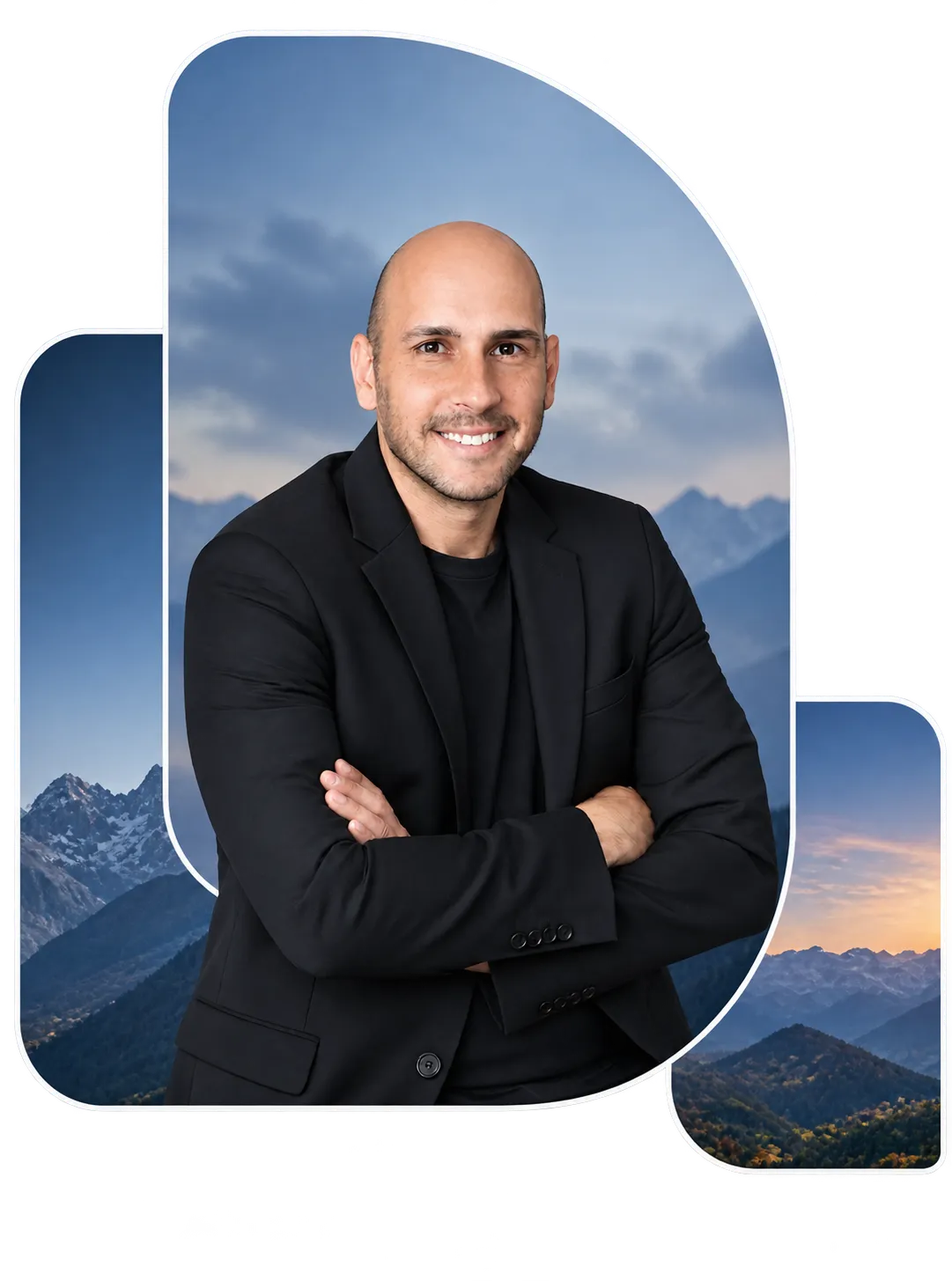 Smiling bald man with crossed arms wearing a black blazer and shirt, with a mountainous landscape background under a partly cloudy sky at dusk.